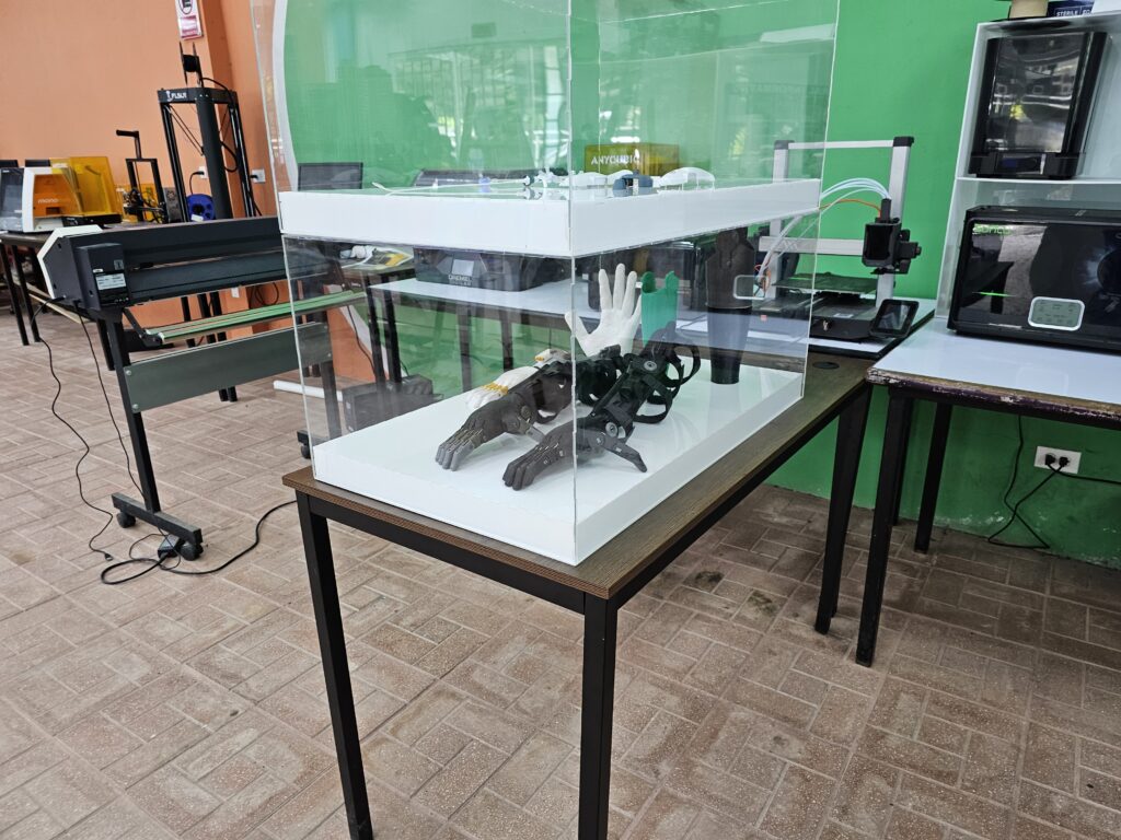 Several prosthetic hands and arms inside an acrylic display case