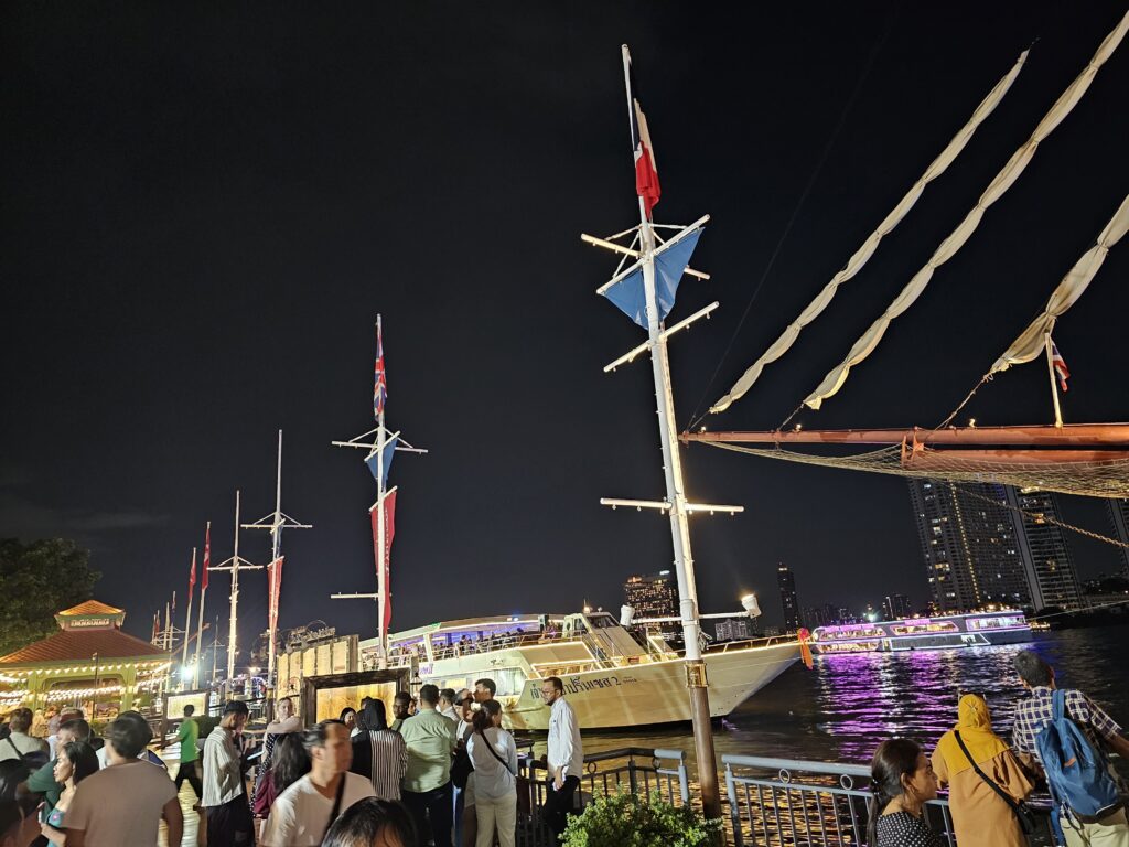 The top of a river ship, lit up at night
