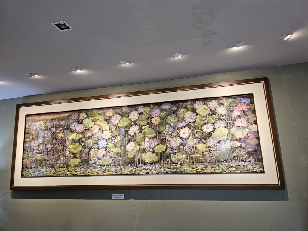 A large watercolor painting of water lillies and their ecosystem